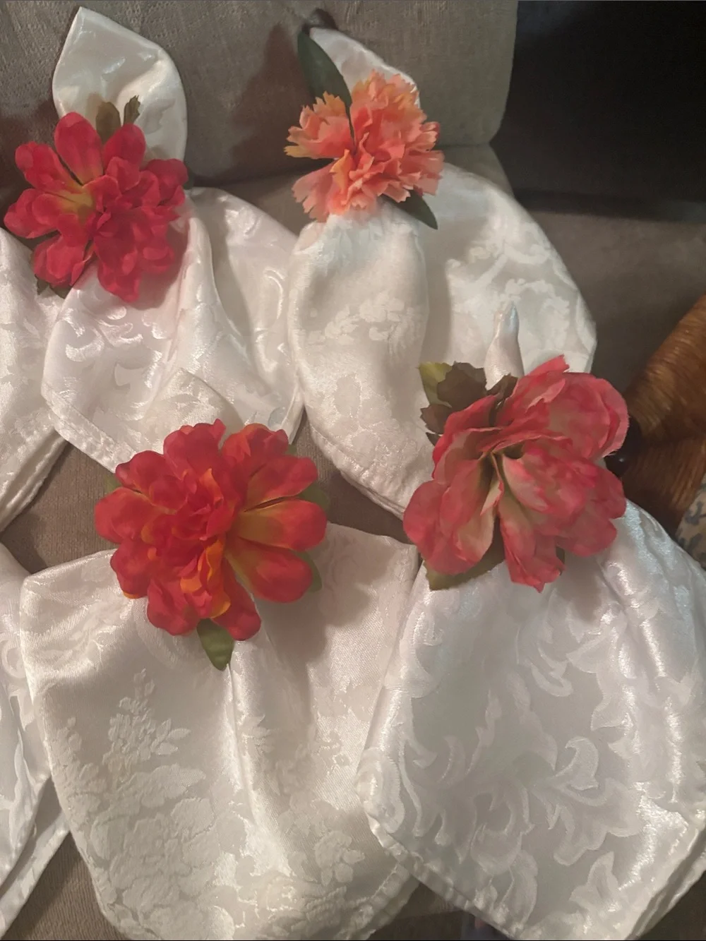 Six large easy care white napkins and 6  floral napkin rings.